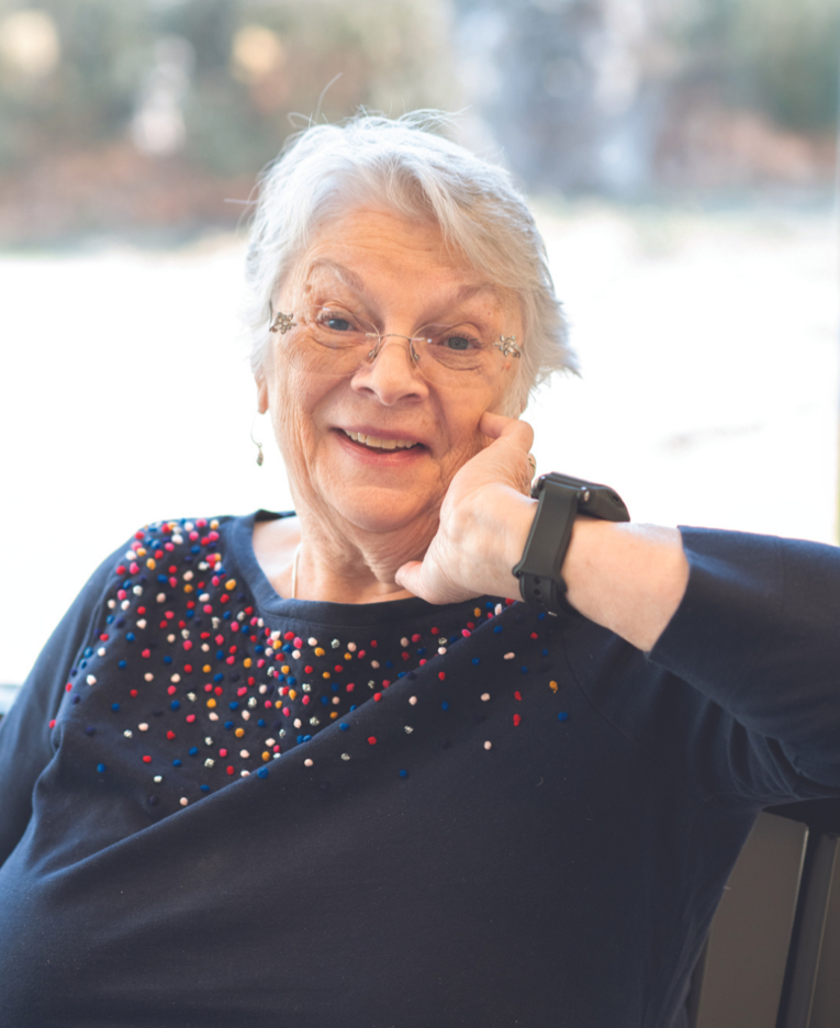 Photo of woman wearing the SafeBeing™ wearable.
